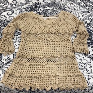 Crocheted sweater or cover up.
